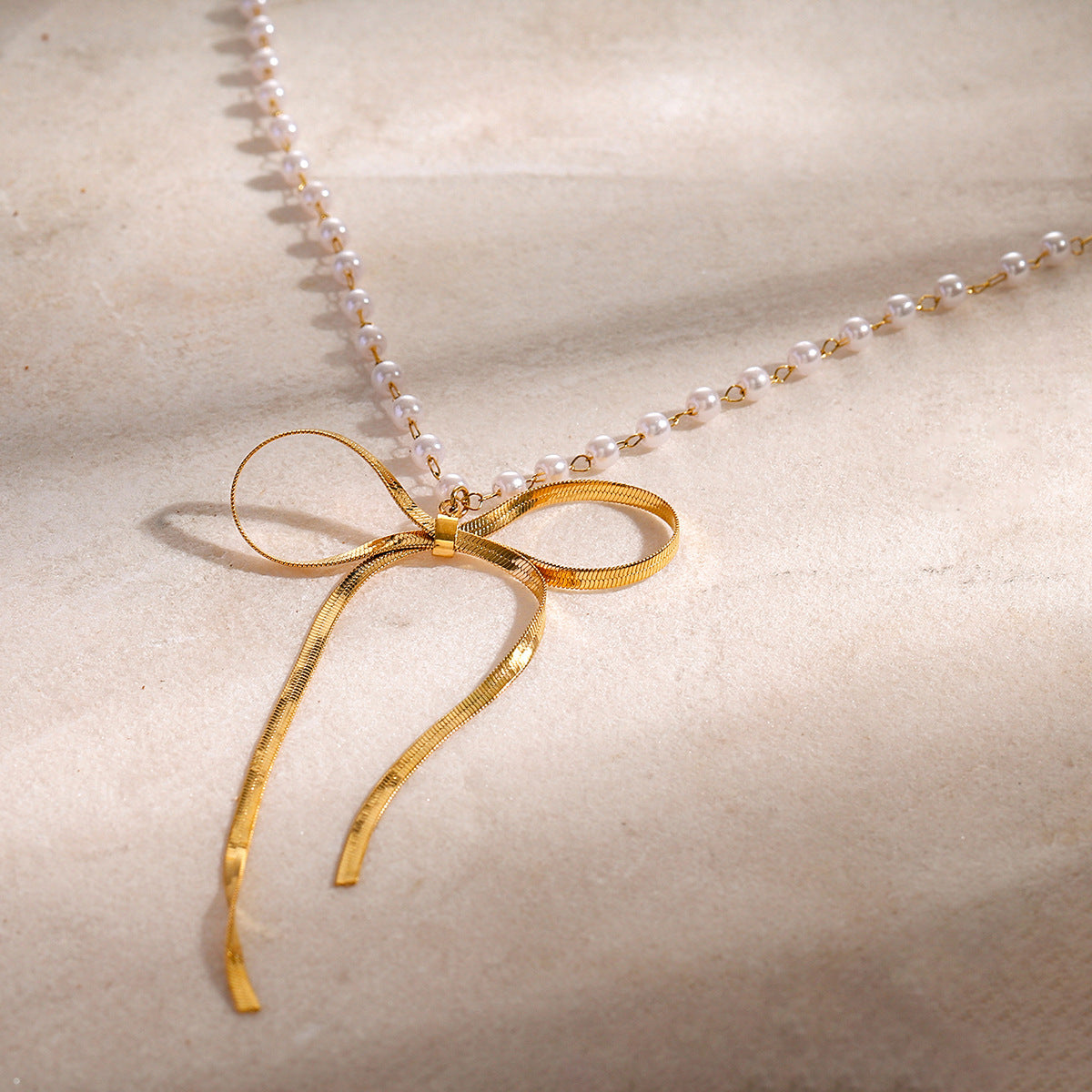 Stainless steel 18k gold-plated bow necklace