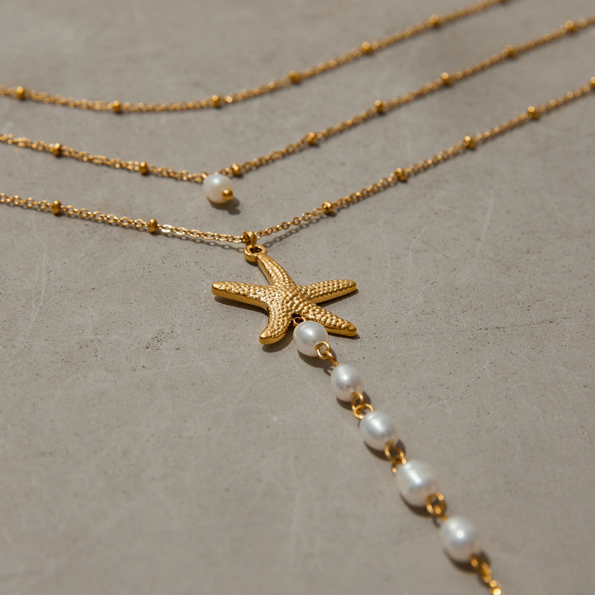 Stainless steel 18k gold-plated pearl starfish necklace