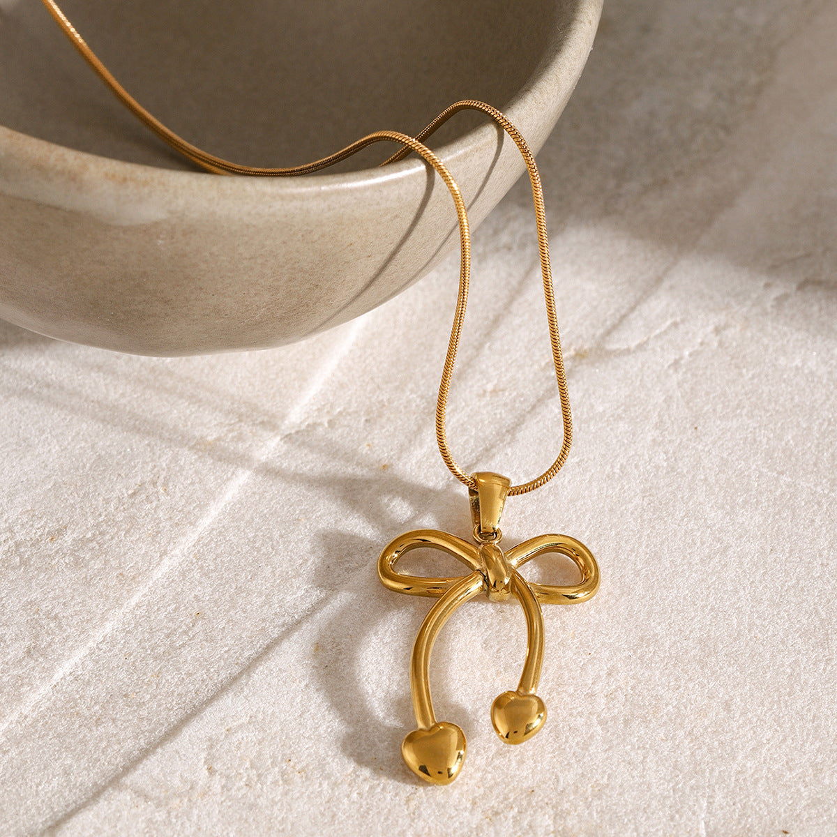 Stainless steel 18k gold-plated bow jewelry set